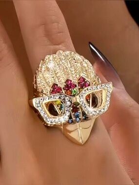 Kurt Geiger Summer stylized eagle's head wearing crystal-encrusted sunglasses